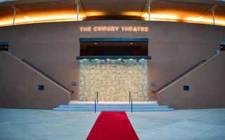 Front of the Crosby Theatre with red carpet on display