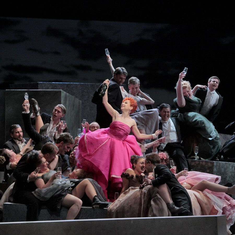 Woman in pink dress having a champagne celebration, La Traviata
