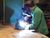 young technician welding