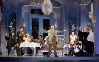 L - R: Efraín Solís (Schaunard), Long Long (Rodolfo), Sylvia D’Eramo (Mimì), Soloman Howard (Colline), Szymon Mechliński (Marcello), Emma Marhefka (Musetta) Kevin Burdette (Alcindoro), photo by Curtis Brown for the Santa Fe Opera